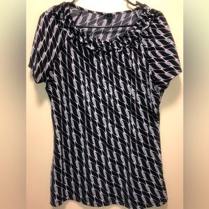 Women’s short sleeve shirt. Brand East 5th. Size Large. Black and white pattern.